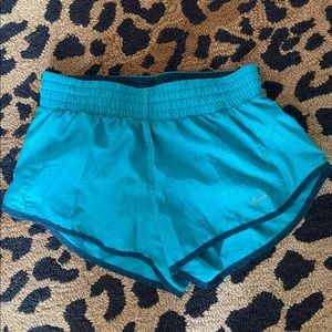 Teal Nike running shorts